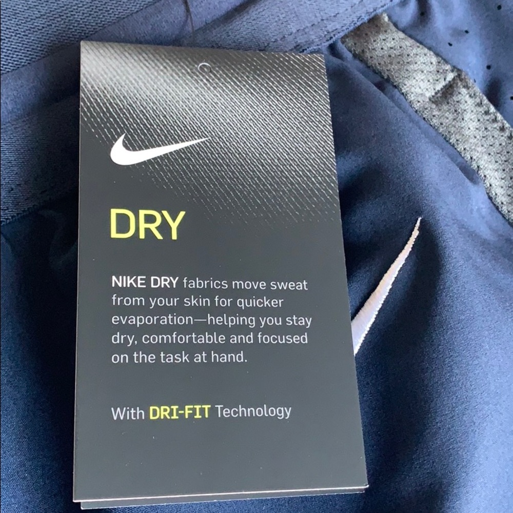 Brand new Nike Dri -Fit navy blue wind pants.